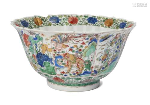 A Chinese porcelain famille verte bowl, Kangxi period, painted in enamels with alternating panels of