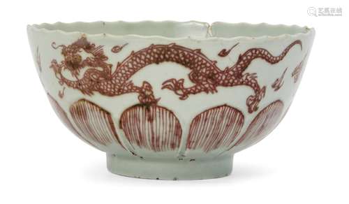 A Chinese porcelain lotus-moulded celadon glazed 'dragon' bowl, Kangxi period, painted in underglaze