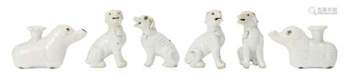 Two pairs of Chinese porcelain hounds and a pair of 'elephant' taper holders, 18th century, the