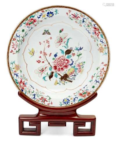 A large Chinese porcelain charger, Yongzheng period, painted in famille rose enamels with