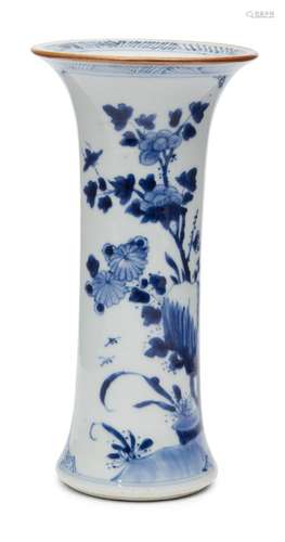 A Chinese porcelain beaker vase, 19th century, painted in underglaze blue and white with peony and