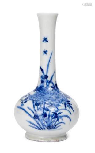 A Chinese porcelain small bottle vase, 19th century, painted in underglaze blue with butterflies