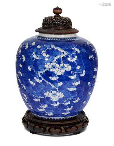 A large Chinese porcelain ginger jar, 19th century, painted in underglaze blue with prunus