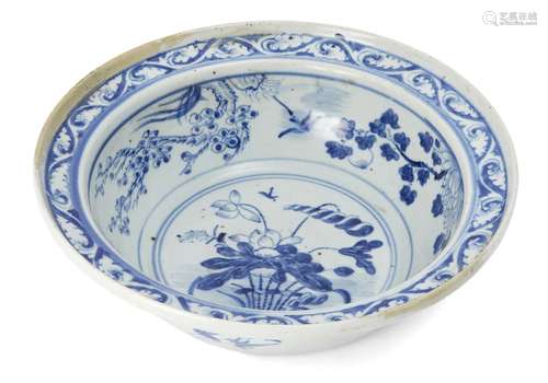 A Chinese porcelain deep bowl, early 19th century, painted to the central reserve with a vase of