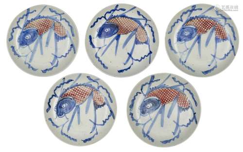 Five Chinese porcelain dishes, 19th century, painted in underglaze blue and iron red with koi