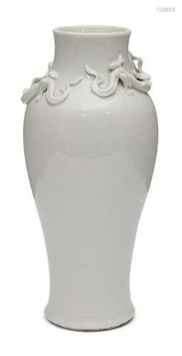 A Chinese Dehua porcelain baluster vase, late Qing dynasty, applied to the neck with two chilong