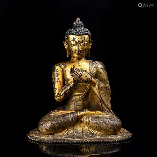 GILT BRONZE FIGURE OF DIPAMKARA BUDDHA