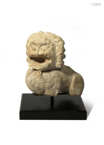 A CHINESE CARVED STONE LION FRAGMENT