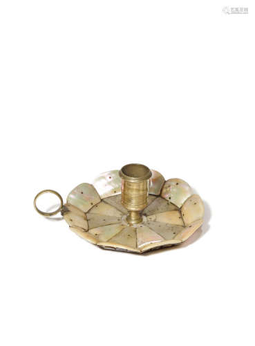 AN INDIAN GUJARAT MOTHER OF PEARL AND BRASS CANDLE HOLDER