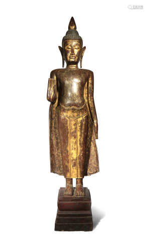 A CAMBODIAN LACQUERED AND PARCEL-GILT WOOD FIGURE OF BUDDHA