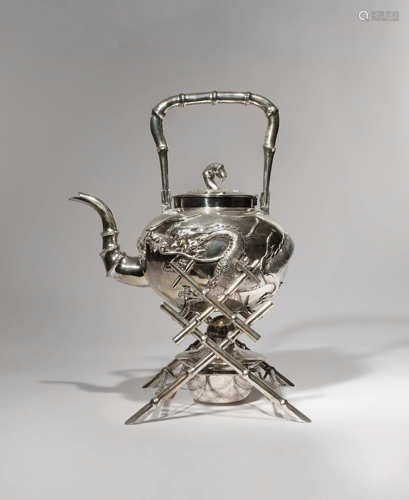 A CHINESE SILVER KETTLE AND STAND