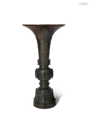 A CHINESE BRONZE GU-SHAPED VASE