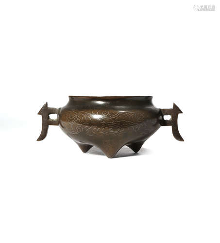 A SMALL CHINESE SILVER INLAID 'SHI SOU' BRONZE TRIPOD INCENSE BURNER