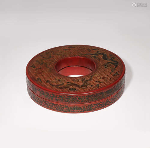 A CHINESE TIANQI RED LACQUER CIRCULAR NECKLACE BOX AND COVER