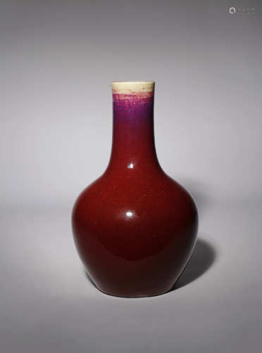 A CHINESE FLAMBE GLAZED BOTTLE VASE