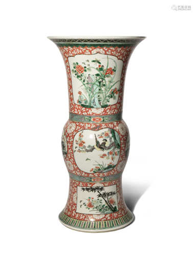 A CHINESE FAMILLE VERTE IRON-RED GROUND GU-SHAPED VASE