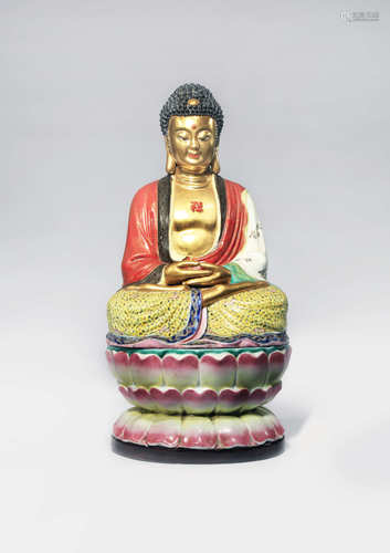 A CHINESE FAMILLE ROSE AND GILT-DECORATED FIGURE OF BUDDHA SHAKYAMUNI