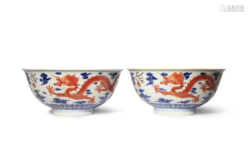 A PAIR OF CHINESE BLUE AND WHITE AND IRON-RED 'DRAGON' BOWLS