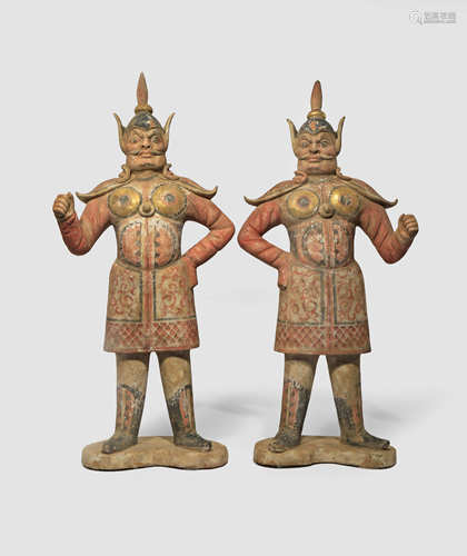 A PAIR OF CHINESE PAINTED POTTERY FIGURES OF GUARDIANS