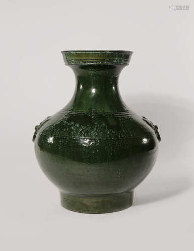 A CHINESE GREEN GLAZED POTTERY HU-SHAPED VASE