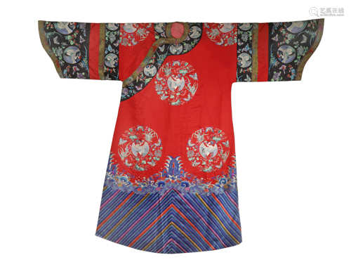 A CHINESE RED-GROUND EMBROIDERED SILK WOMAN'S INFORMAL ROBE