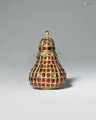 AN INDIAN GOLD GEM-SET KOHL BOTTLE AND COVER