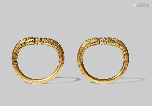 A PAIR OF CHINESE GILT BRONZE BANGLES