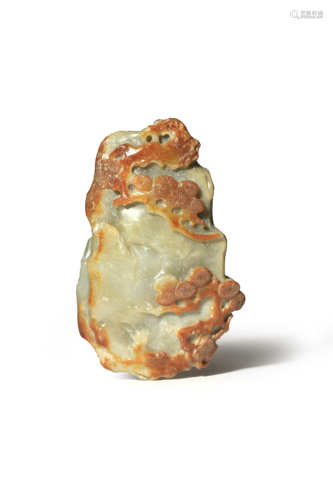 A CHINESE CELADON AND RUSSET JADE DESK WEIGHT