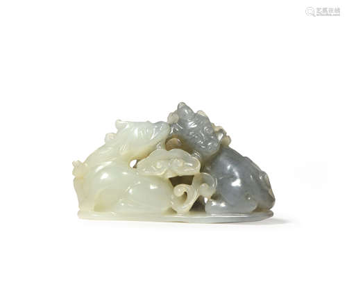 A CHINESE PALE CELADON AND GREY JADE CARVING OF TWO MYTHICAL CREATURES