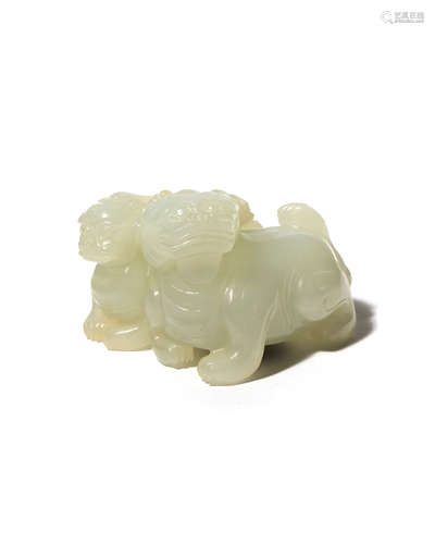 A CHINESE PALE CELADON JADE CARVING OF TWO MYTHICAL CREATURES