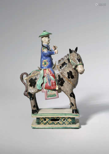 A CHINESE ROSE-VERTE MODEL OF AN EQUESTRIAN RIDING A HORSE