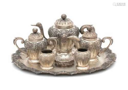 A Djokja tea service, comprising of; a teapot, milkjug, sugarpot, two small vases and six small