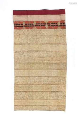 A Minangkabau songket cloth richly decorated with gold embroided horizontal bands of geometric