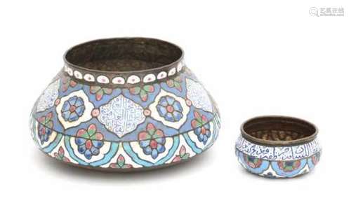 Two enamelled Iznik pots, decorated with floral patterns and koran texts. 19th centuryheight 6,5 and