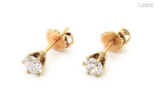 A pair of yellow gold solitaire earrings, set with old European cut diamonds, total ca. 0.90 ct,