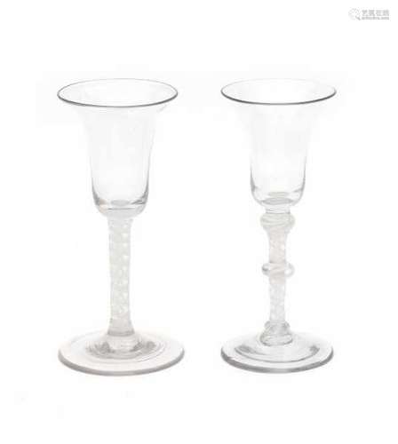 Two English 'twist' wineglasses, one 'knopped', both with white double spiral. 18th centuryheight 17