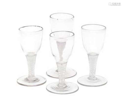 A collection of four English 'twist' wine glasses, with white double spiral in the stem. 18th