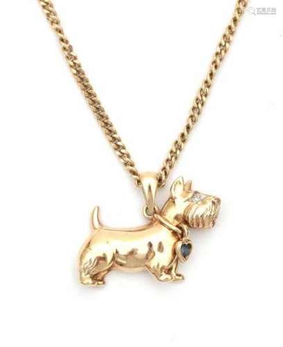 A 14 carat yellow gold pendant shaped like a terrier with necklace. Set with a single cut diamond,