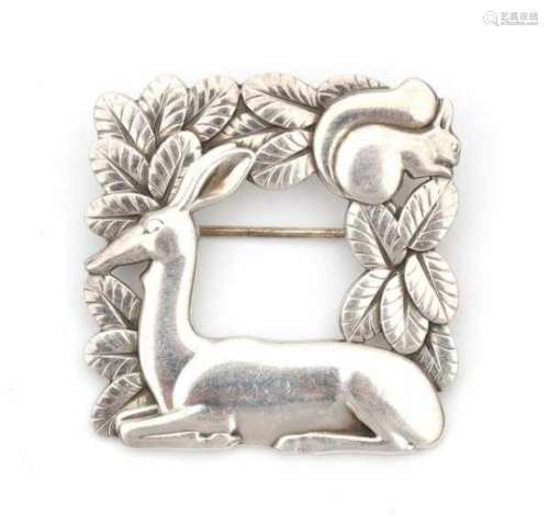 A sterling silver square shaped brooch with deer and squirrel made post 1945, by George Jensen,
