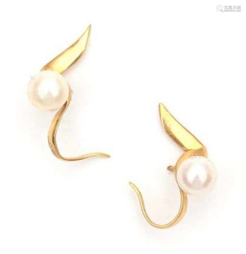A pair of yellow gold earrings by Paloma Picasso for Tiffany & Co, 1983. Set with cultured pearls