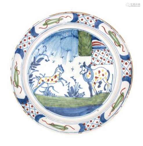 A Delft polychroom plate, decorated with two horses in the meadow. 18th century.Diameter 22,5 cm.- -