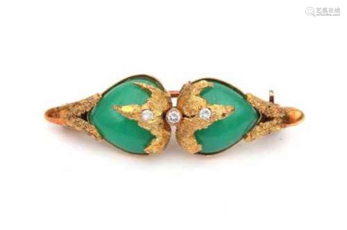 A yellow gold brooch made in the 1960's - 1970's, set with two fancy cabochon cut chrysoprases,