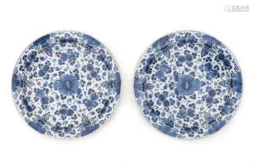 A pair of Delftware blue and white chargers, decorated with a floral pattern. 18th centuryDiameter