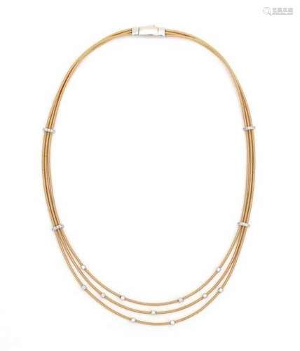 A three strands 18 carat yellow gold necklace, by Marco Bicego, Italy, model Goa. With white gold