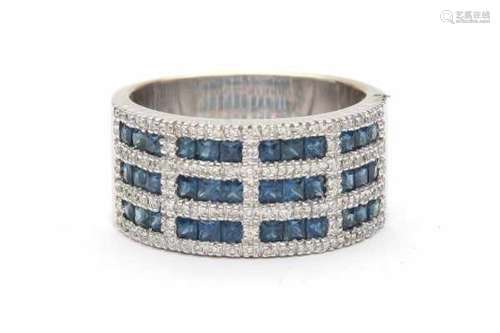 A 14 carat white gold ring, set with square cut natural Sapphires, total ca. 0.75 ct and brilliant