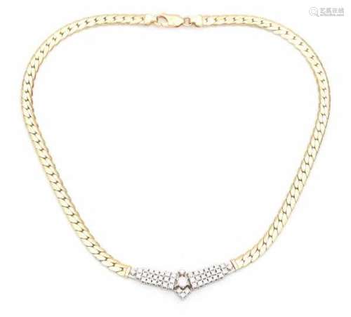 A 14 carat yellow and white gold necklace with center piece. Length: ca. 46.5 cm. Set with brilliant