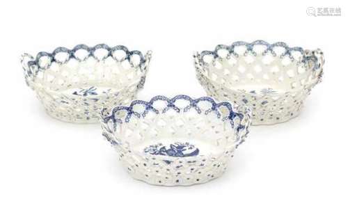 Three English blue and white softpaste baskets, decorated with 'pine cone'pattern. Marked with a