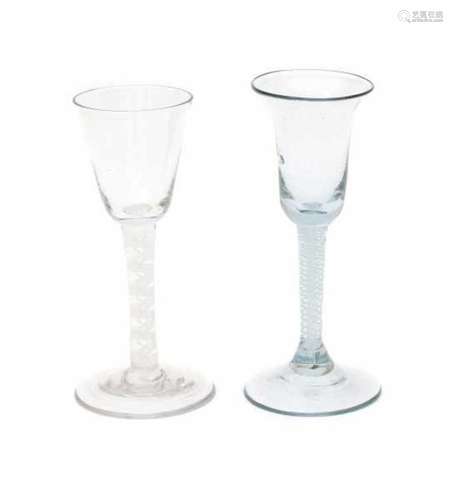 Two English 'twist' wineglasses, with double white spiral. 18th century.height 16 cm.- - -29.00 %