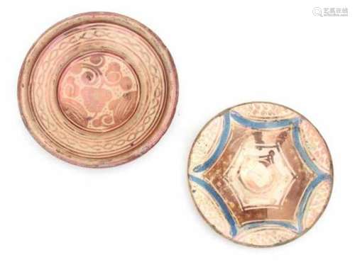 Two Hispano-Moresque dishes with luster glaze, decorated with a star and a floral pattern. 17th