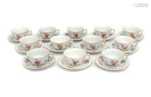 A set of twelve cup and saucers, decorated with a variety of flowers. MeissenDiameter 14 cm.- - -